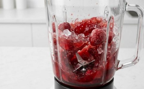 Food processor vs blender placed side by side on a modern kitchen counter